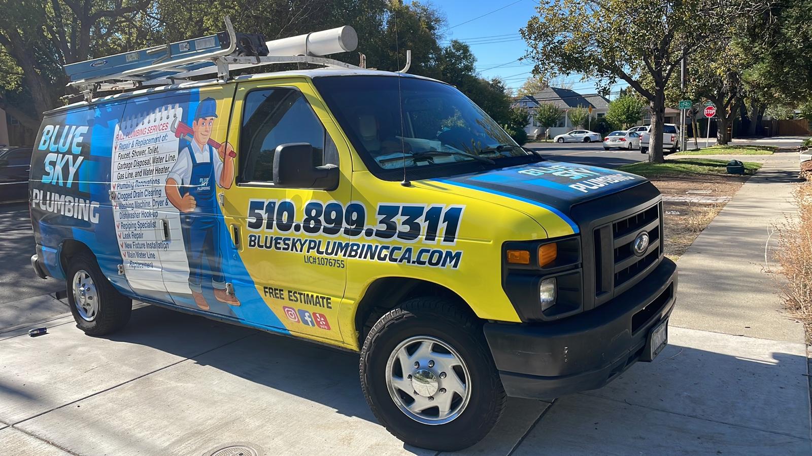 Blue Sky Plumbing wrapped van, front three-quarter view