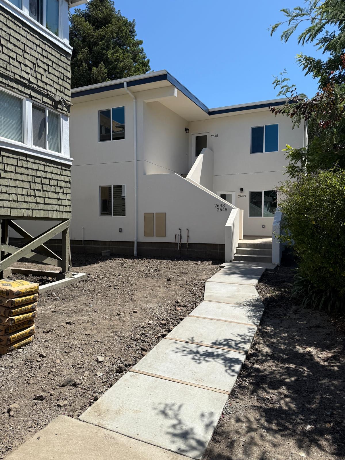 Finished two-unit building after completion of the plumbing system