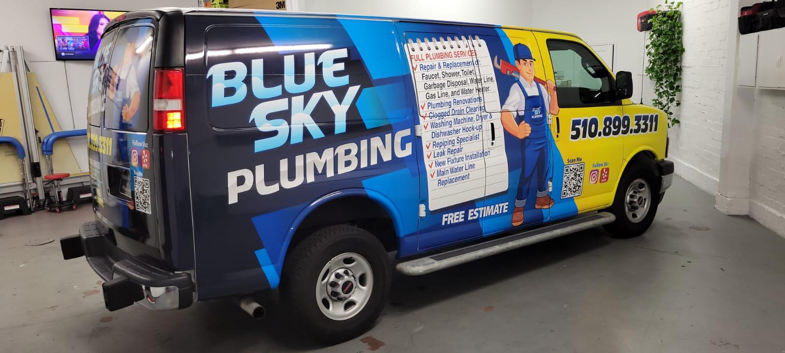 Blue Sky Plumbing wrapped GMC van, rear three-quarter view