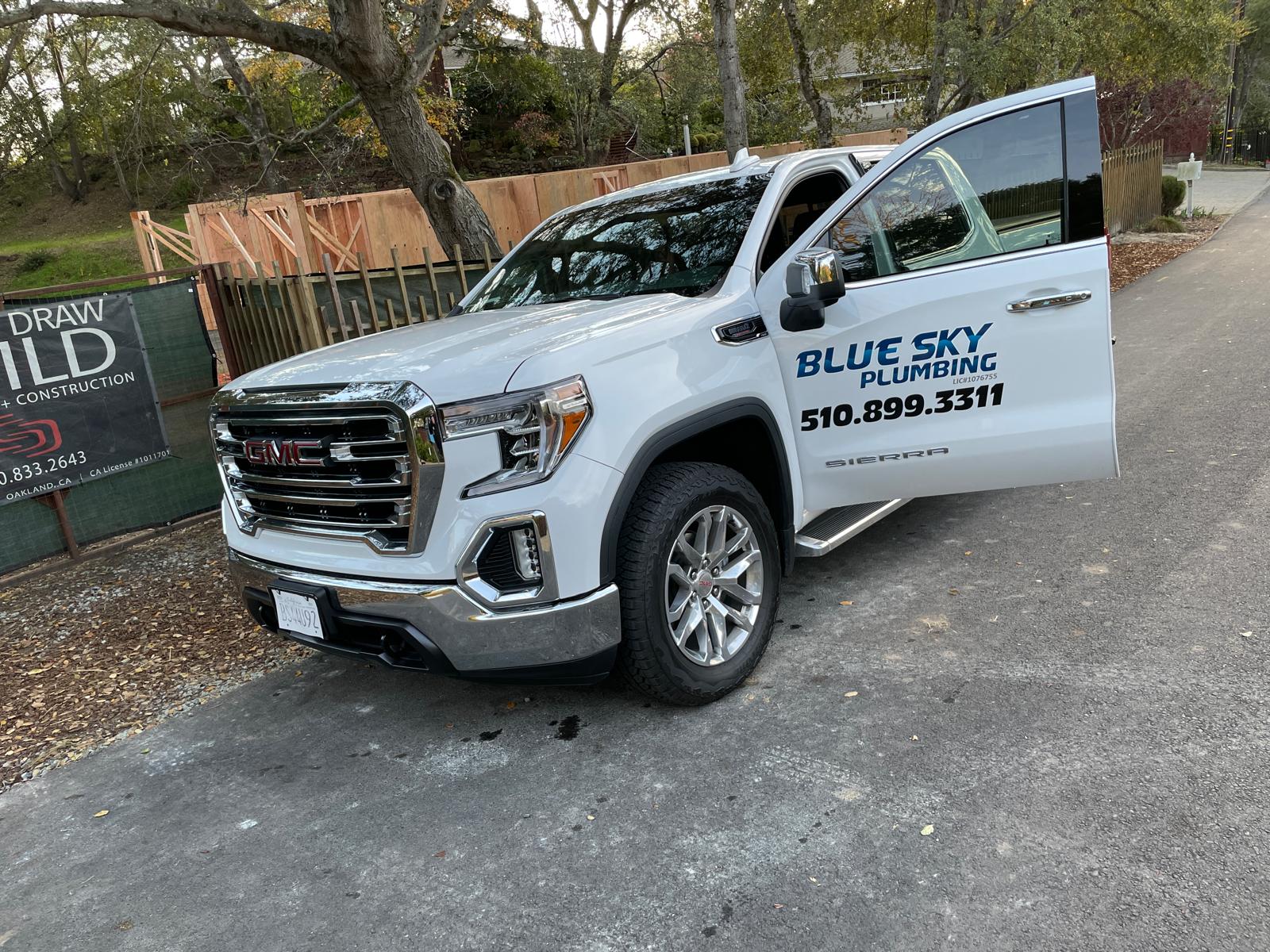 Blue Sky Plumbing white GMC Sierra service truck